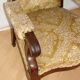 An antique armchair from the turn of the 19th and 20th centuries, carved wa