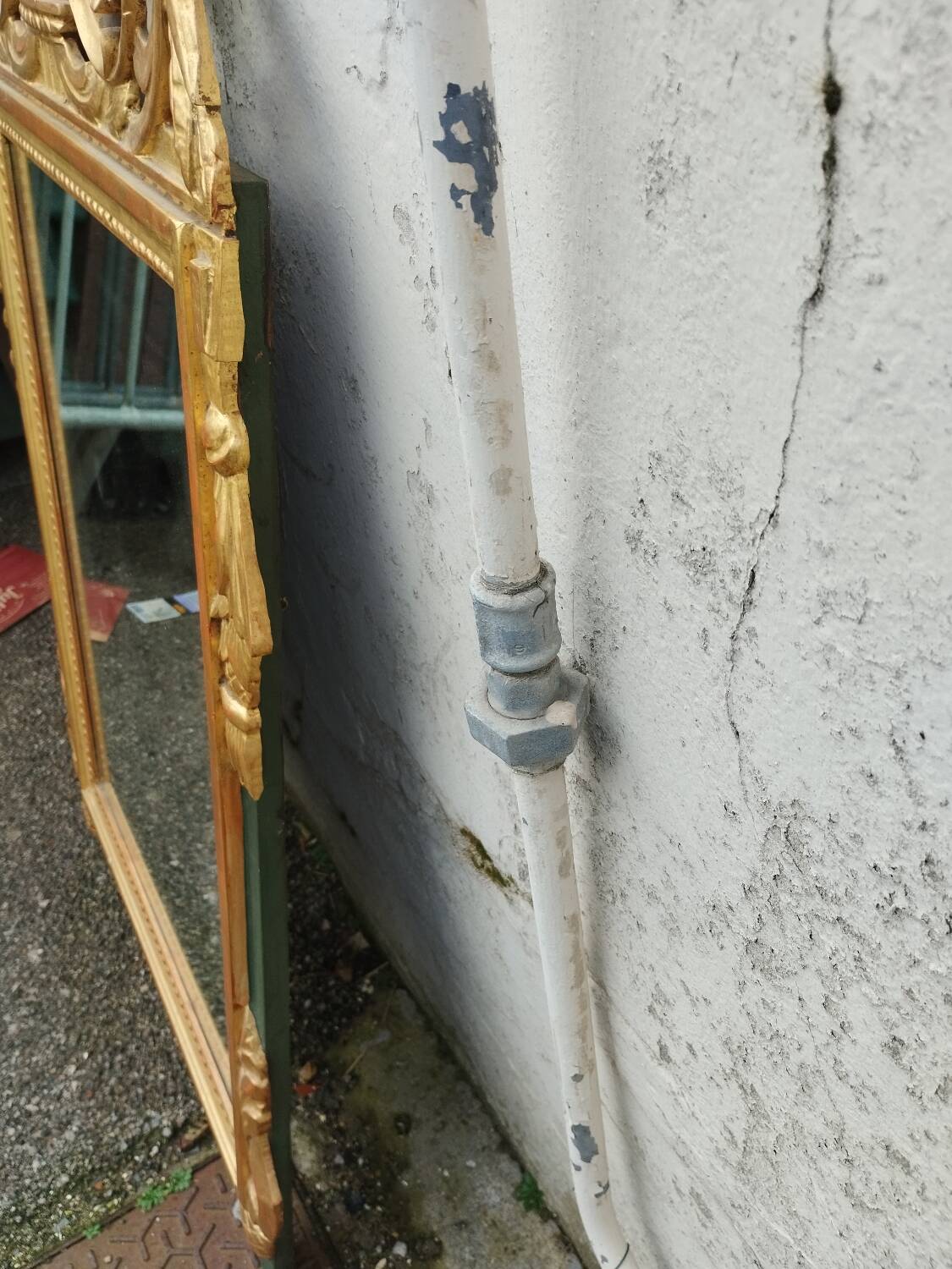 Antique gilded wooden mirror in Louis XVI style