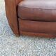 Paire de fauteuils club en cuir brun des années 30
