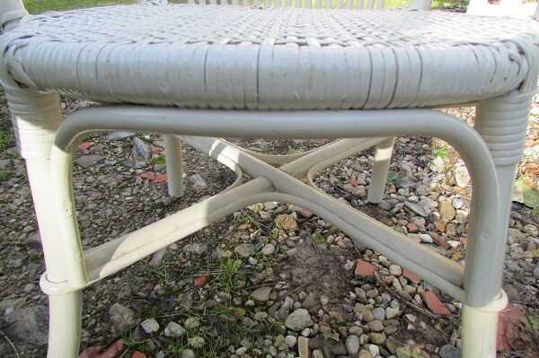 Low armchair in wicker and rattan