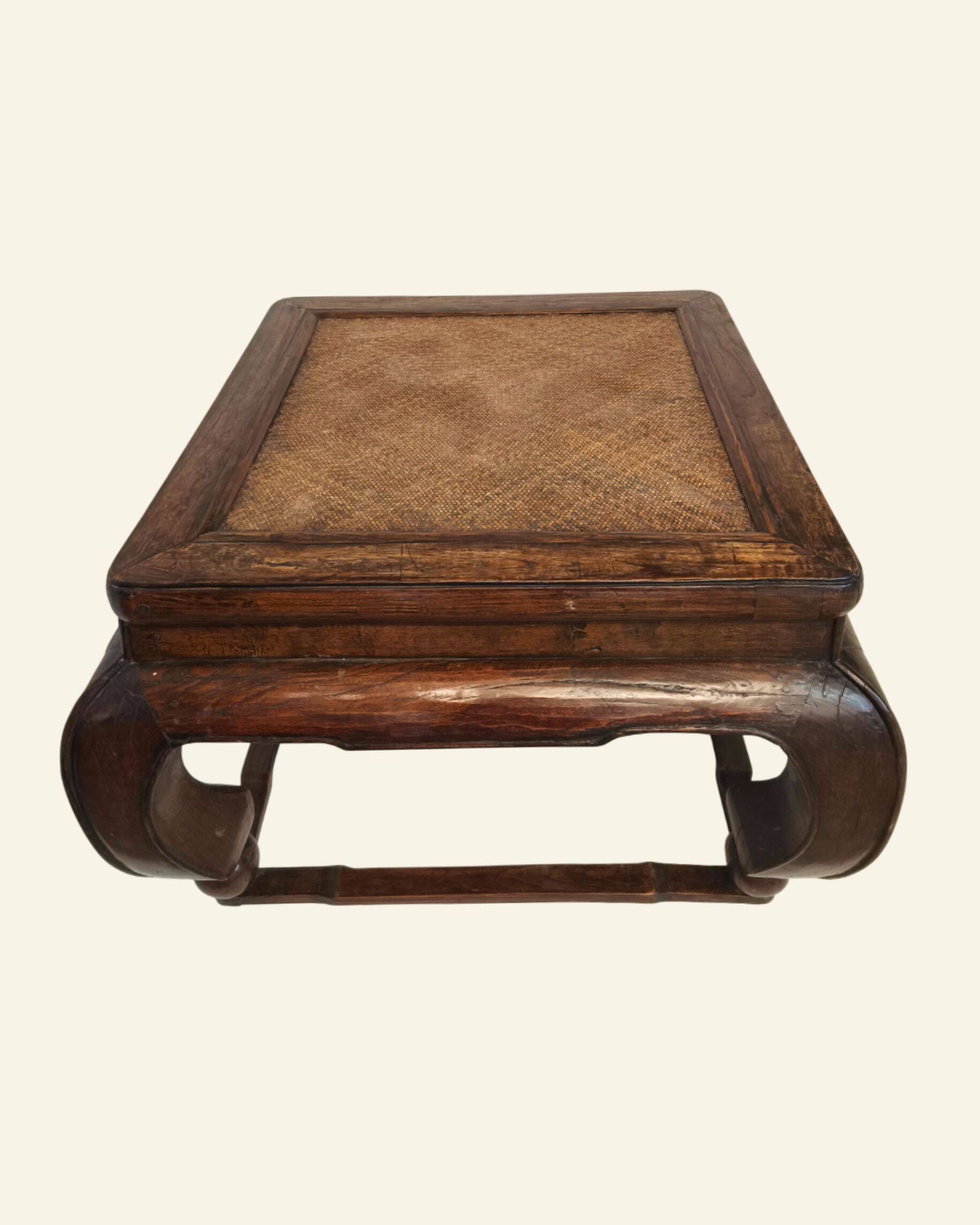 Antique Chinese coffee table in elm, rattan top, 19th century.