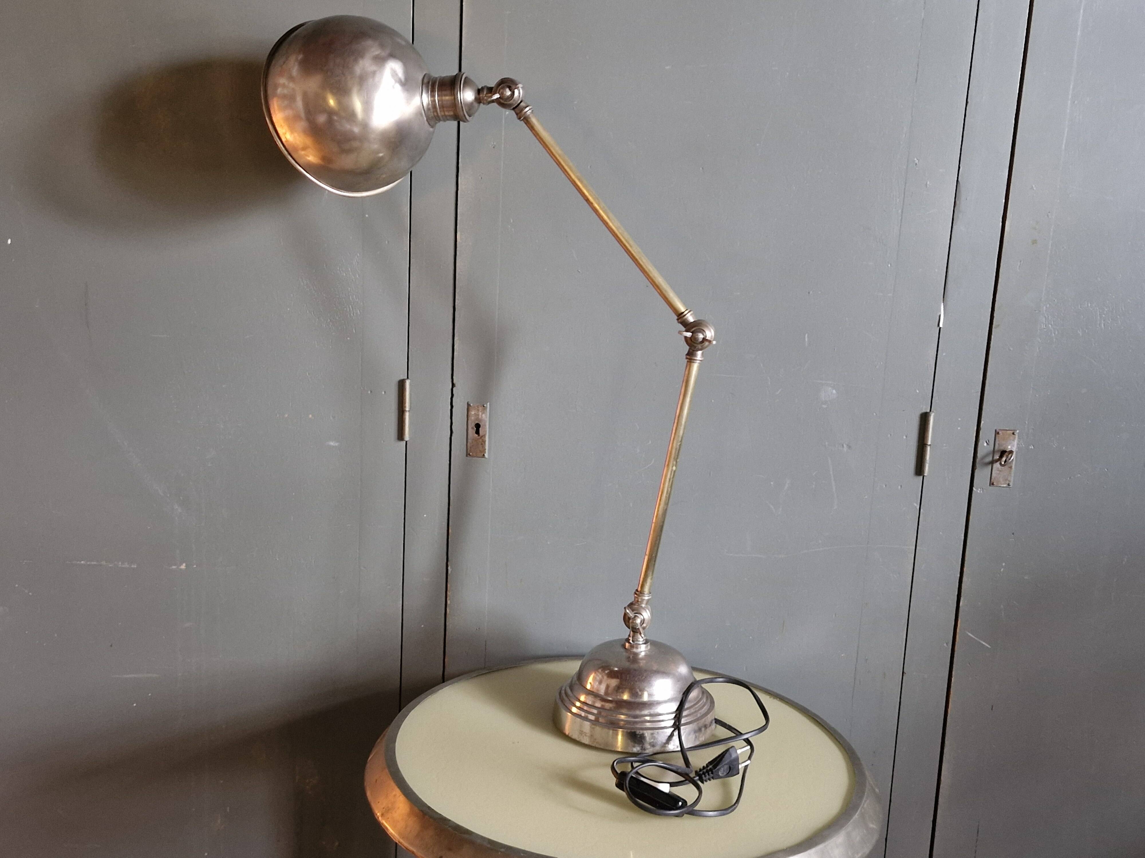 Old adjustable industrial lamp in bronze with 2 arms.