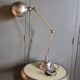 Old adjustable industrial lamp in bronze with 2 arms.