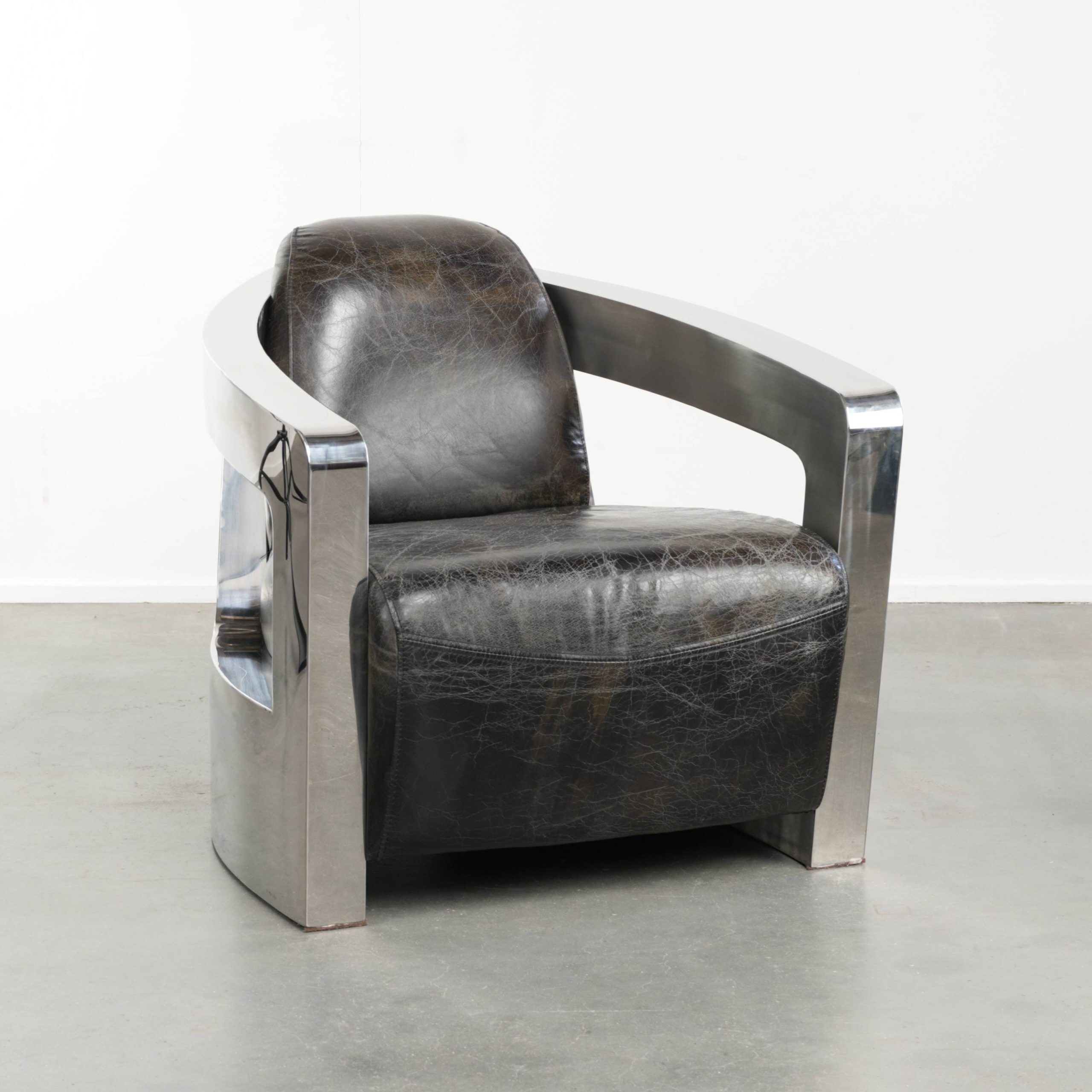 Industrial Aviator design armchair in cowhide finished with aluminium