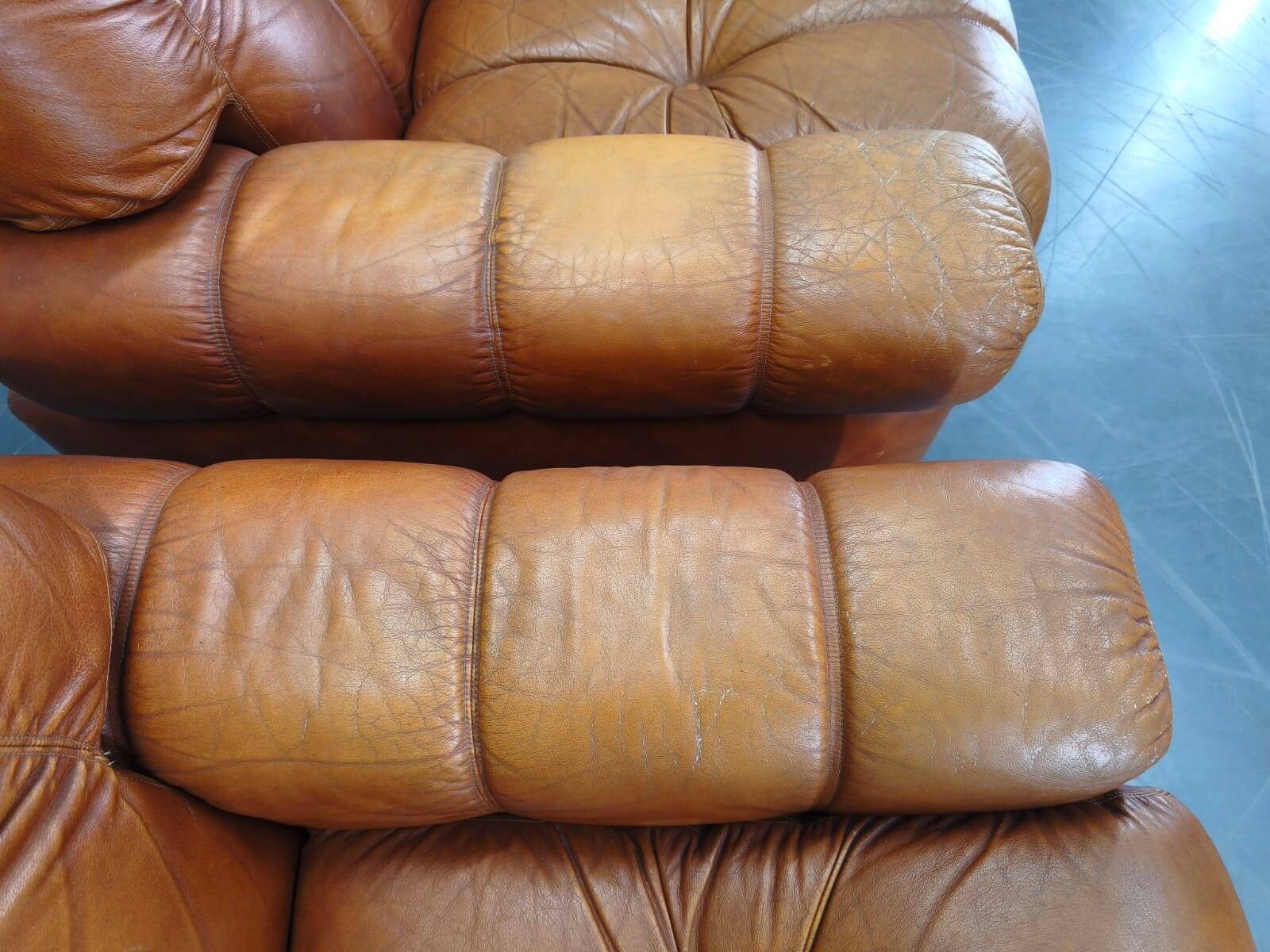 Pair of modern Italian armchairs from the mid-20th century, cognac leather, 1970.