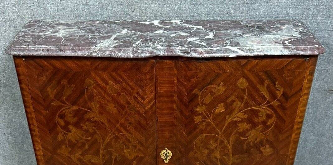 Wooden cabinet with doors, richly inlaid with floral patterns, Louis XV style.