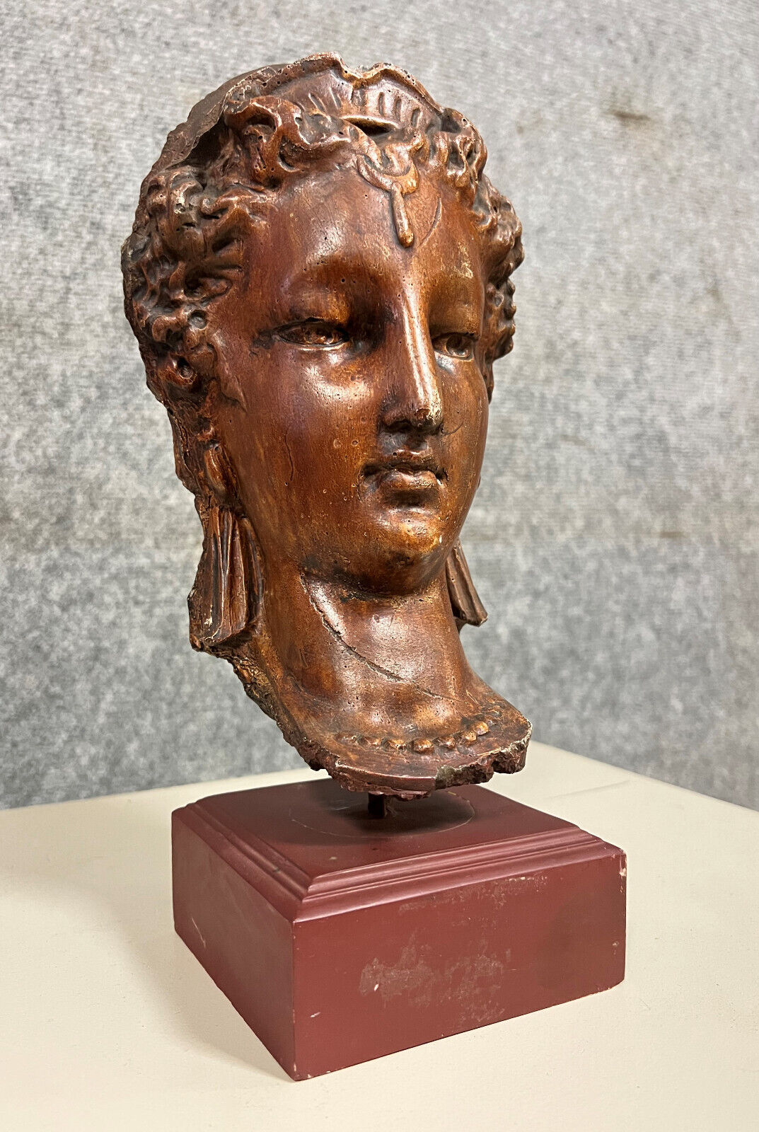 Diane de Poitiers stone bust on a terrace in false pretense of marble