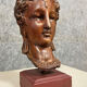 Diane de Poitiers stone bust on a terrace in false pretense of marble