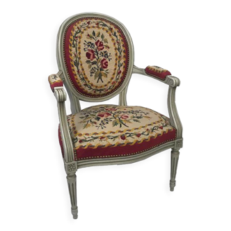 Louis XVI style armchair in grey lacquered wood, medallion backrest, upholstered with tapestry with small poin