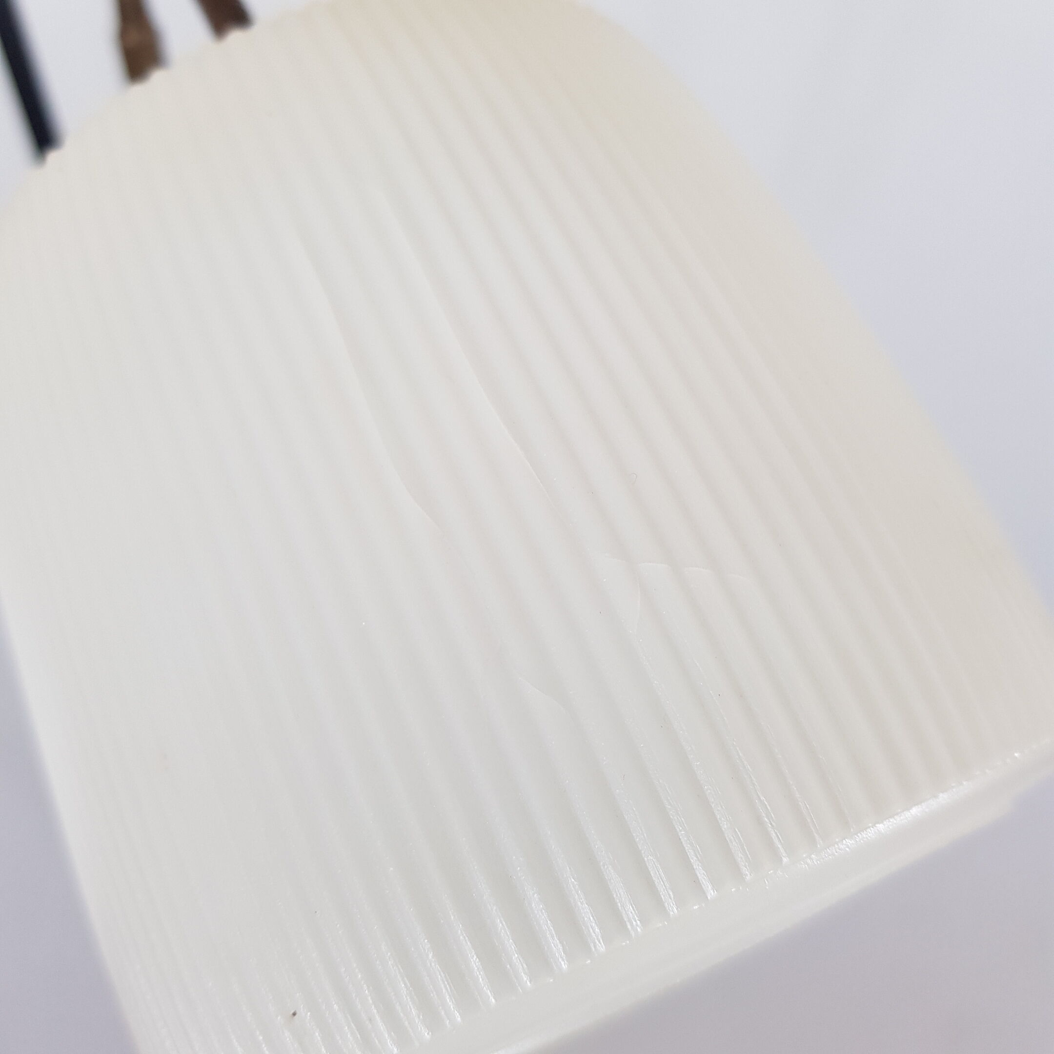 Golden brass tripod lamppost