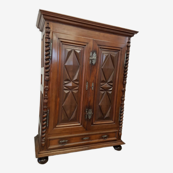 Louis XIII period wardrobe in walnut with diamond points and twisted columns