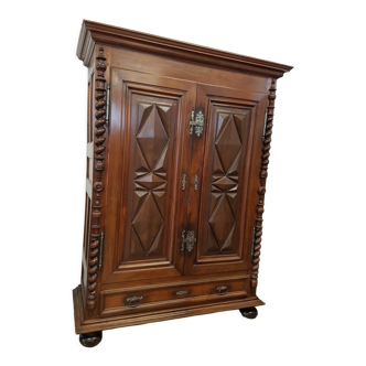 Louis XIII period wardrobe in walnut with diamond points and twisted columns