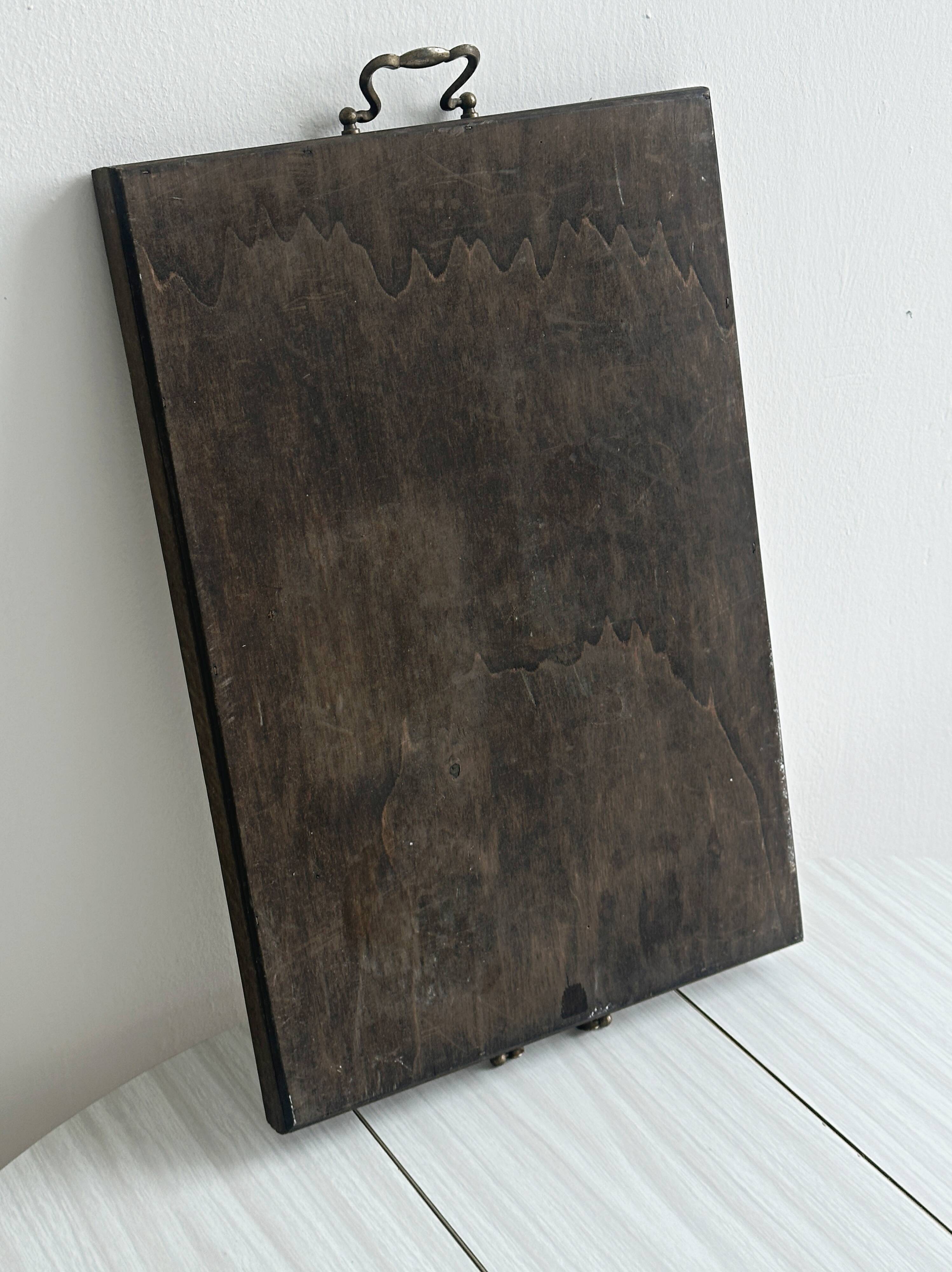 Old wooden plateau with floral tiles