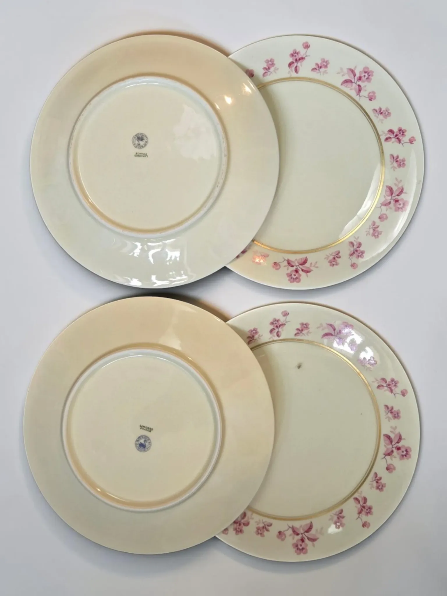 4 flat plates in fine Limoges porcelain from the Raynaud house.