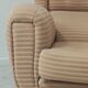 Beige wingback armchair and TVAR footrest, former Czechoslovakia.