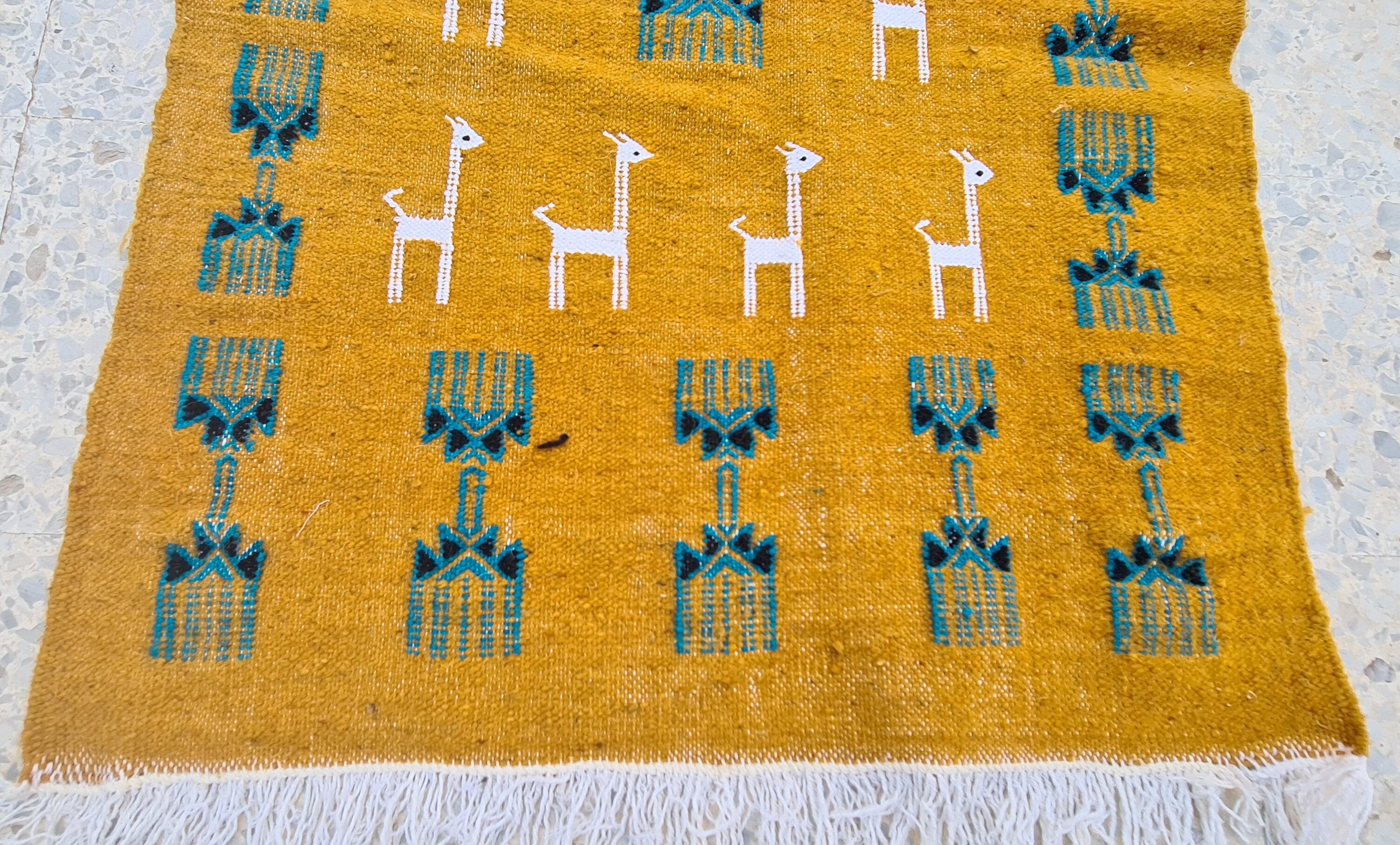 Traditional handmade gazelle-patterned carpet in pure wool