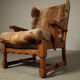 Brutalist oak lounge chair and ottoman in original goat hide, 1960s