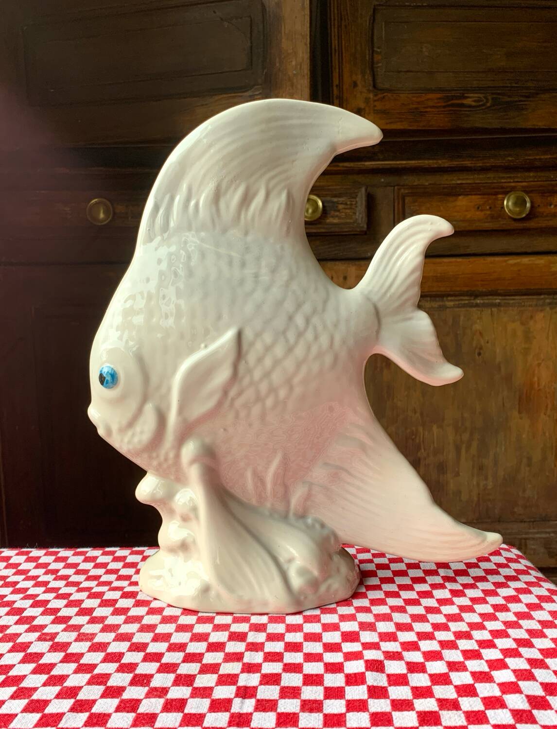 Large white ceramic fish to place.