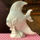 Large white ceramic fish to place.