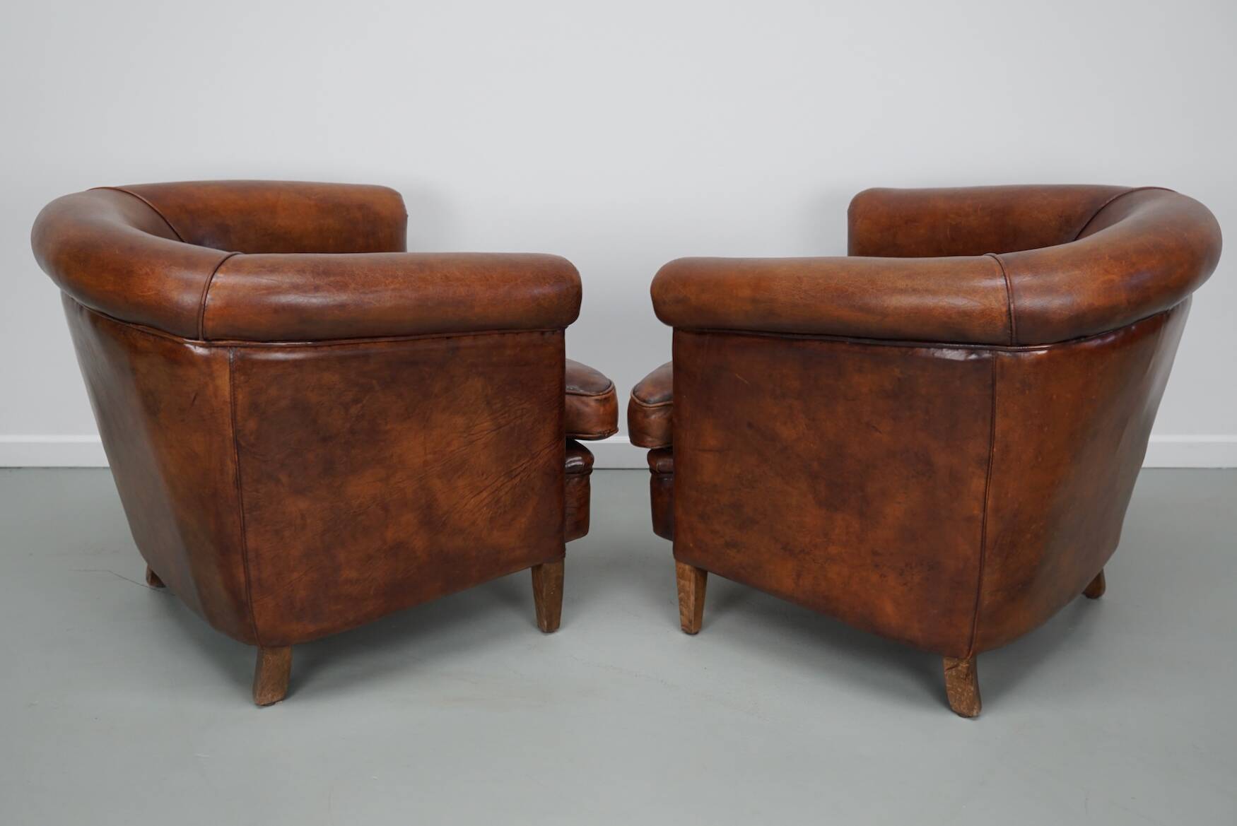 Vintage Dutch cognac coloured leather club chair, set of 2 with footstool