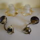 Wall lamps, opaque corolla and iridescent ochre lampshade, brass and wood support
