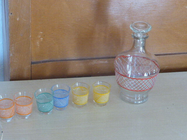 Service a Liqueur consisting of a metal servant, a carafe and 6 small vintage glasses 1950