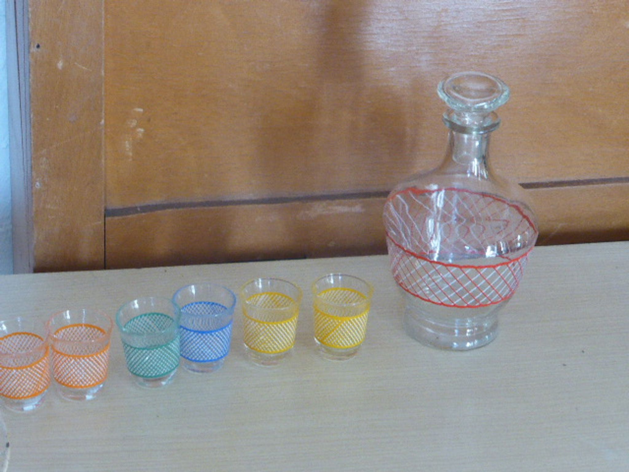 Service a Liqueur consisting of a metal servant, a carafe and 6 small vintage glasses 1950
