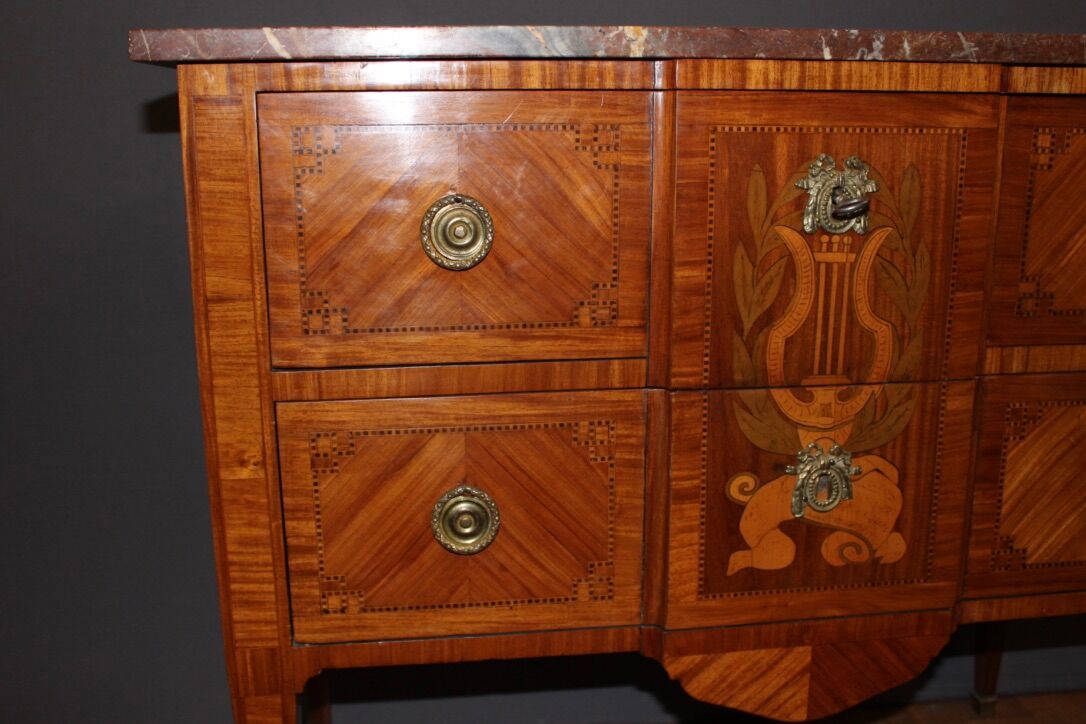 Louis XVI style chest of drawers with music attributes