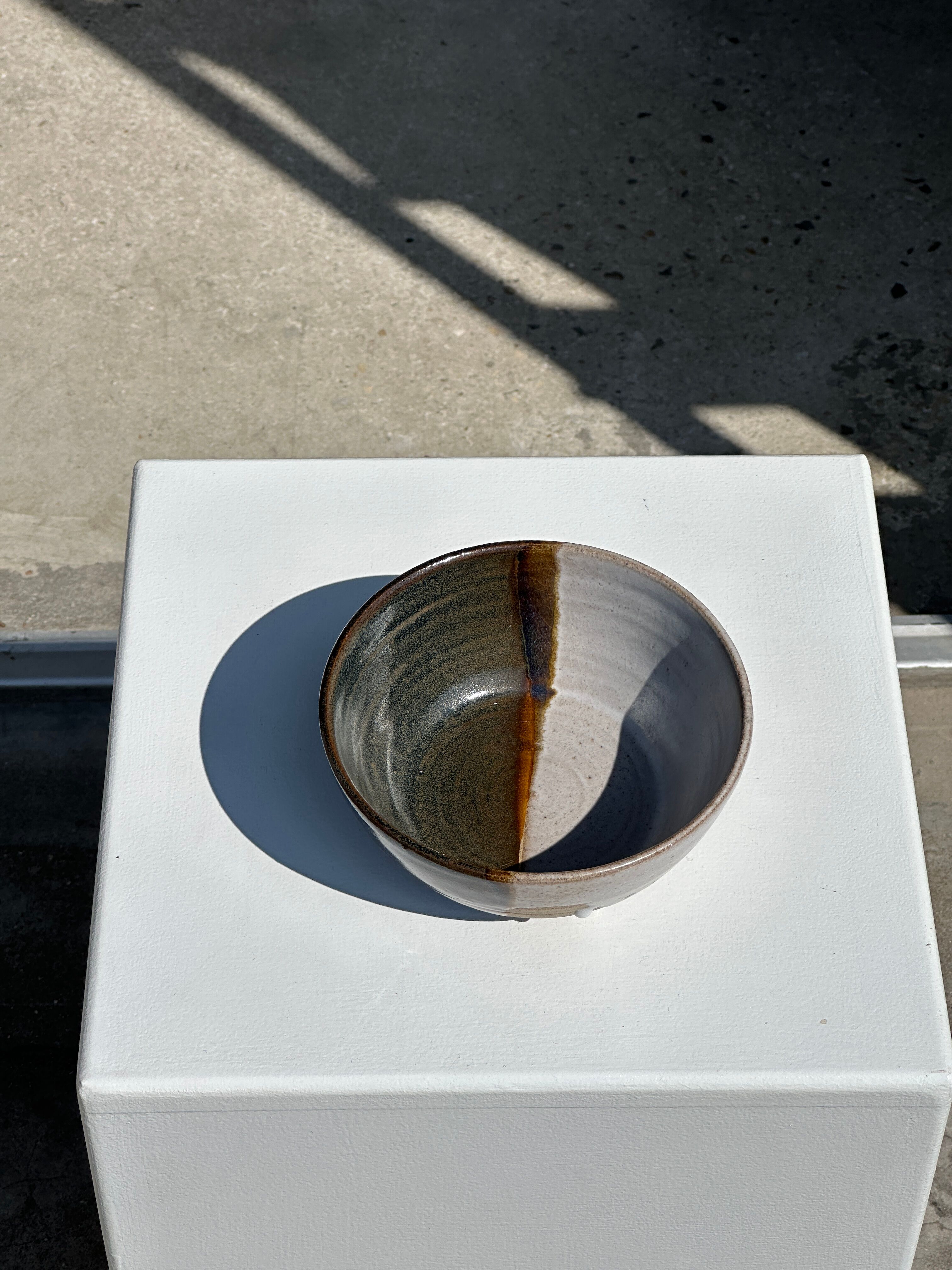 White and glossy brown two-tone ceramic bowl, matt earth