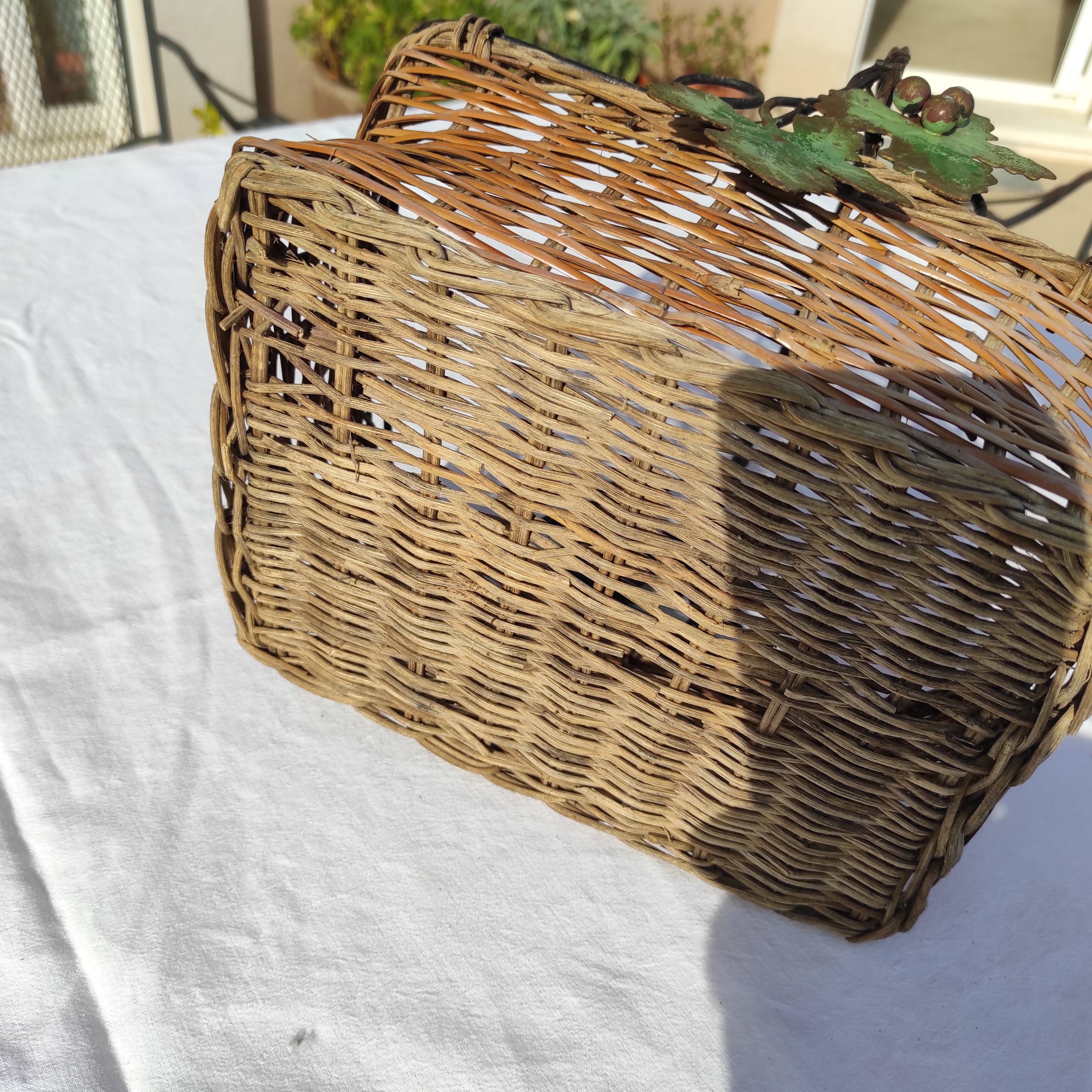 Old wicker basket decoration vine leaves and grapes