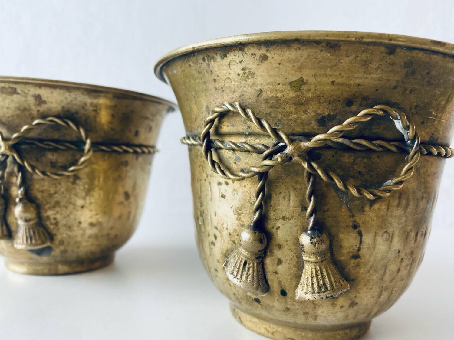 Pair of brass cord pot covers