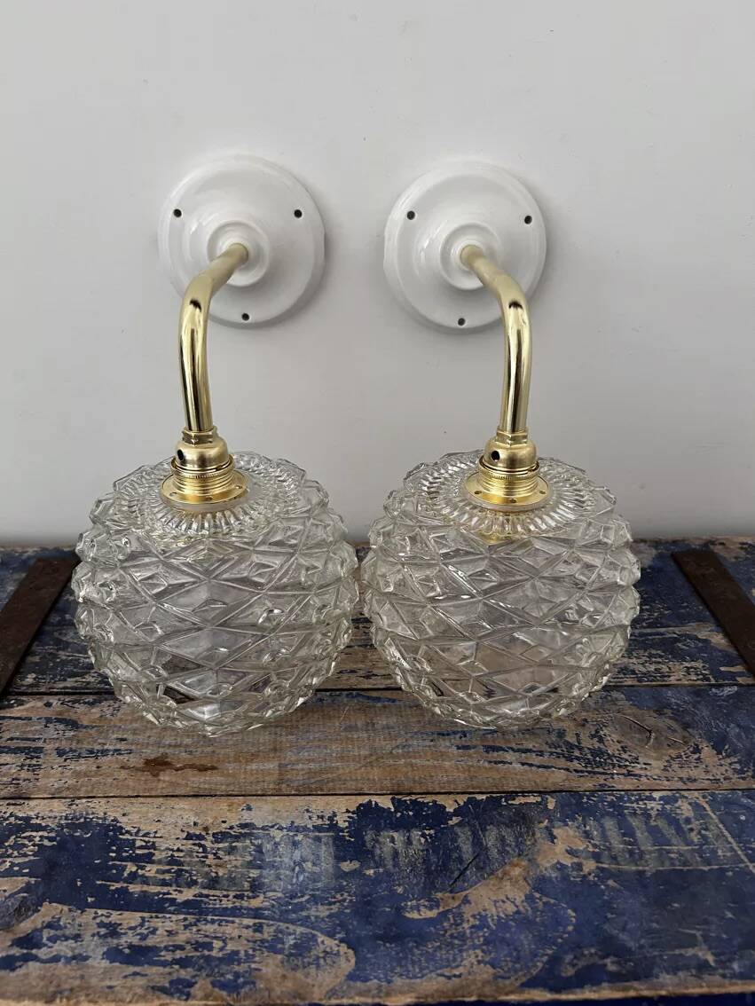 Pair of chiseled glass wall sconces