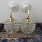 Pair of chiseled glass wall sconces