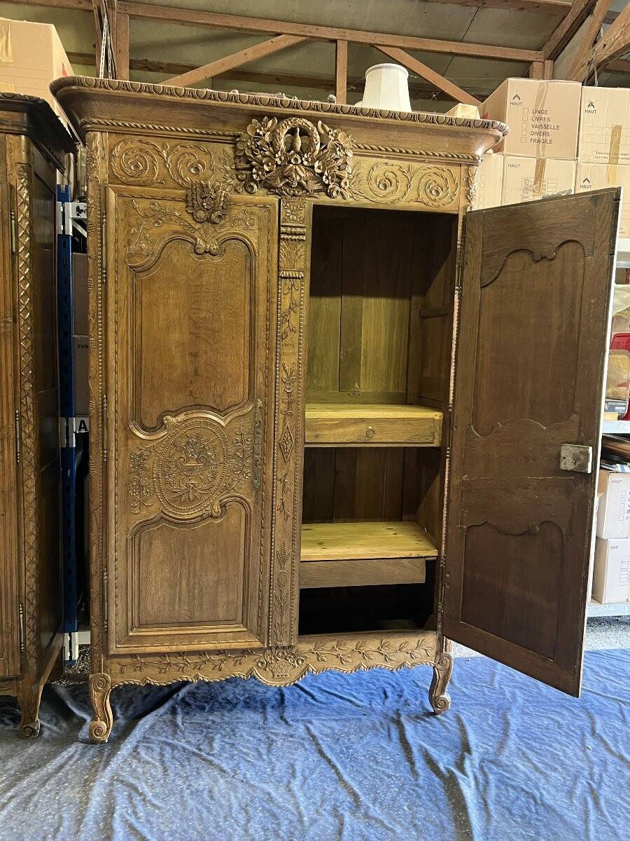 19th-century Norman wedding armoire, with bouquets of flowers and doves.