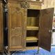 19th-century Norman wedding armoire, with bouquets of flowers and doves.