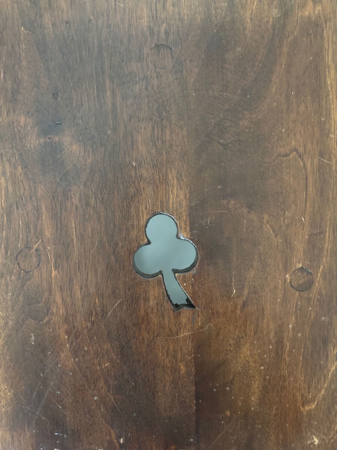 Small antique wooden stool with an openwork pattern.