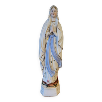 Religious statuette of the Virgin Mary in bisque porcelain