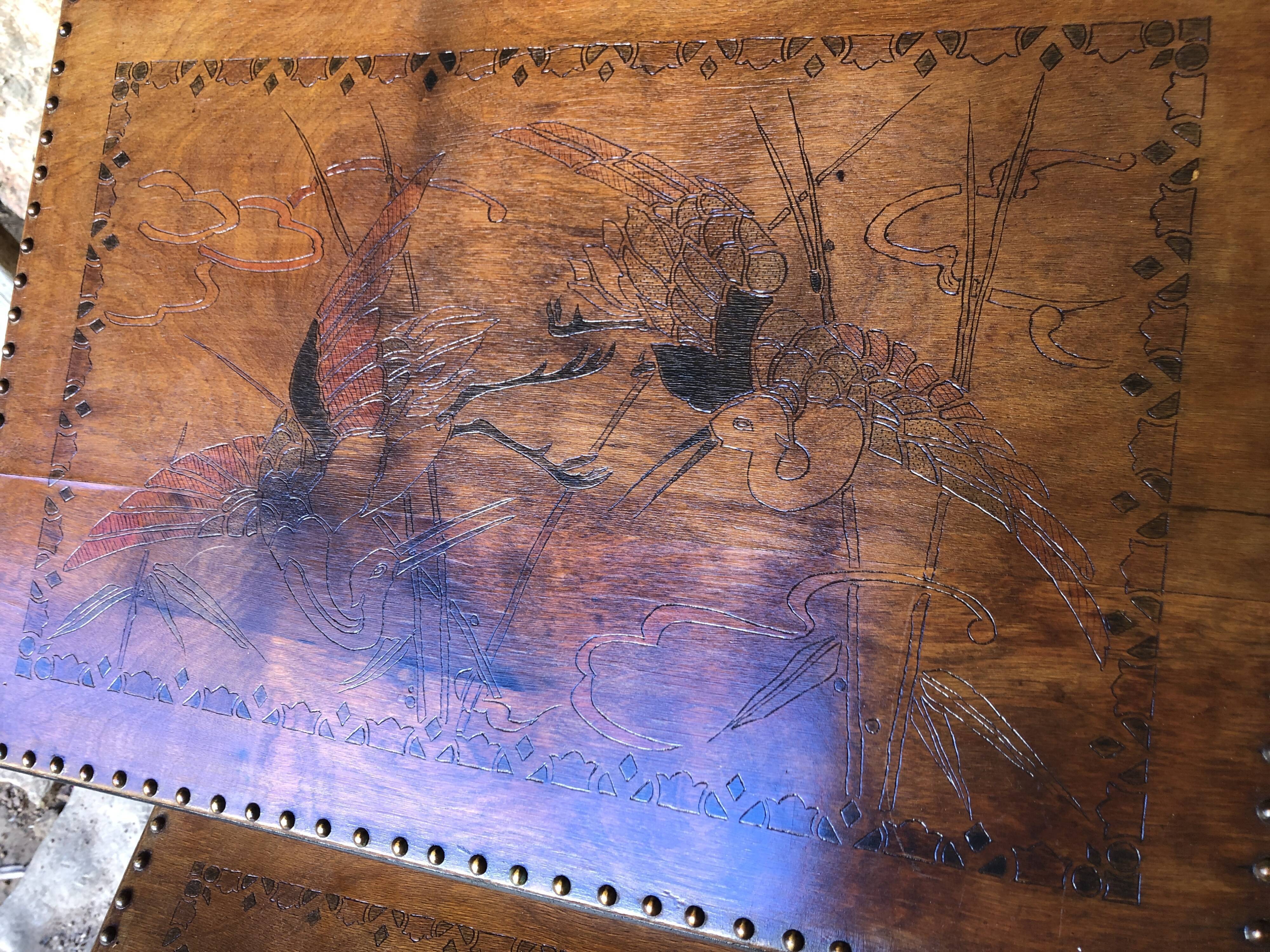 Pair of studded nesting tables from the 1930s.