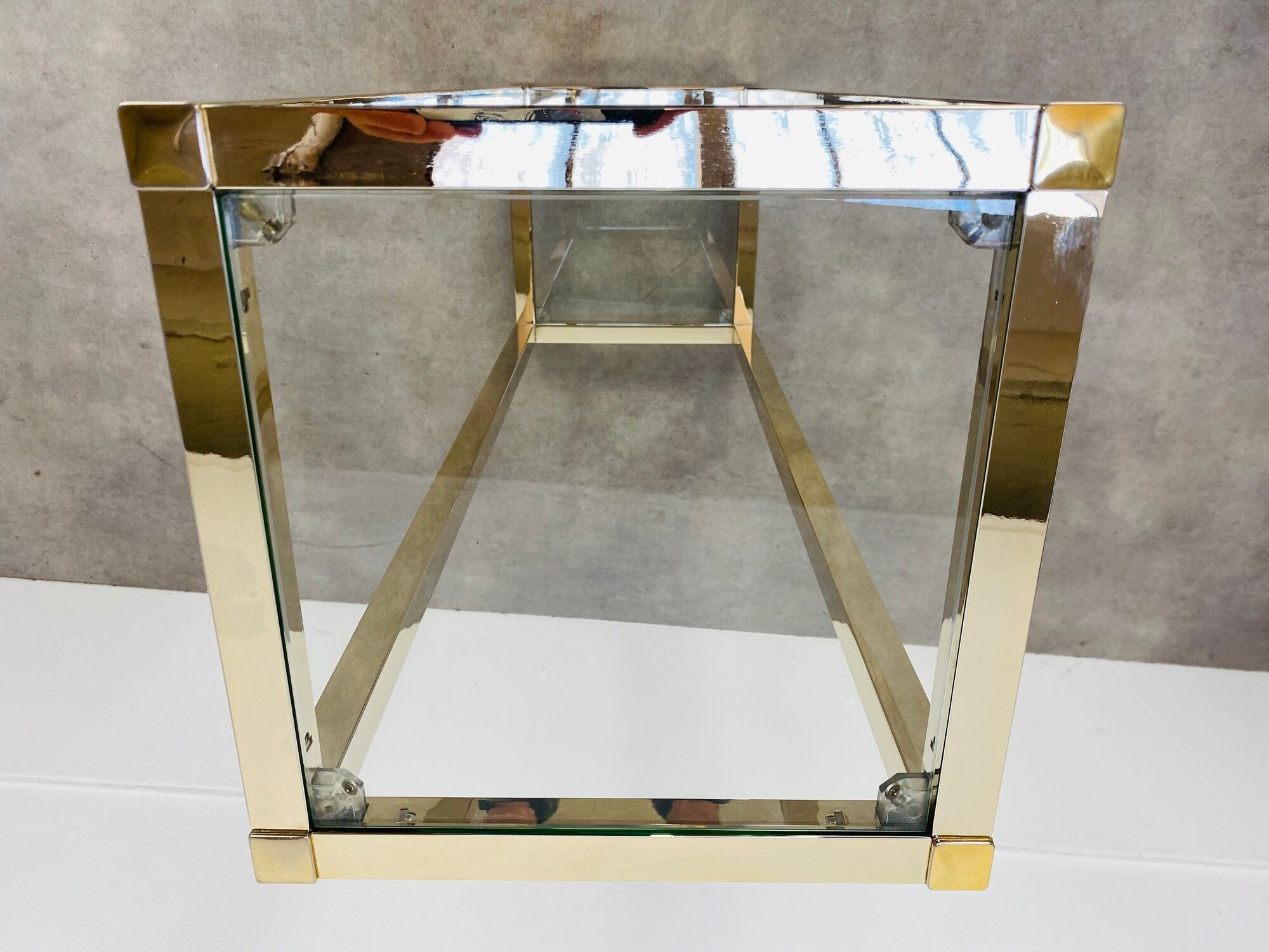 Gilded metal fifth wheel column and Hollywood Regency style glass 70s