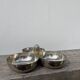 Silver-plated metal dish topped with an acorn