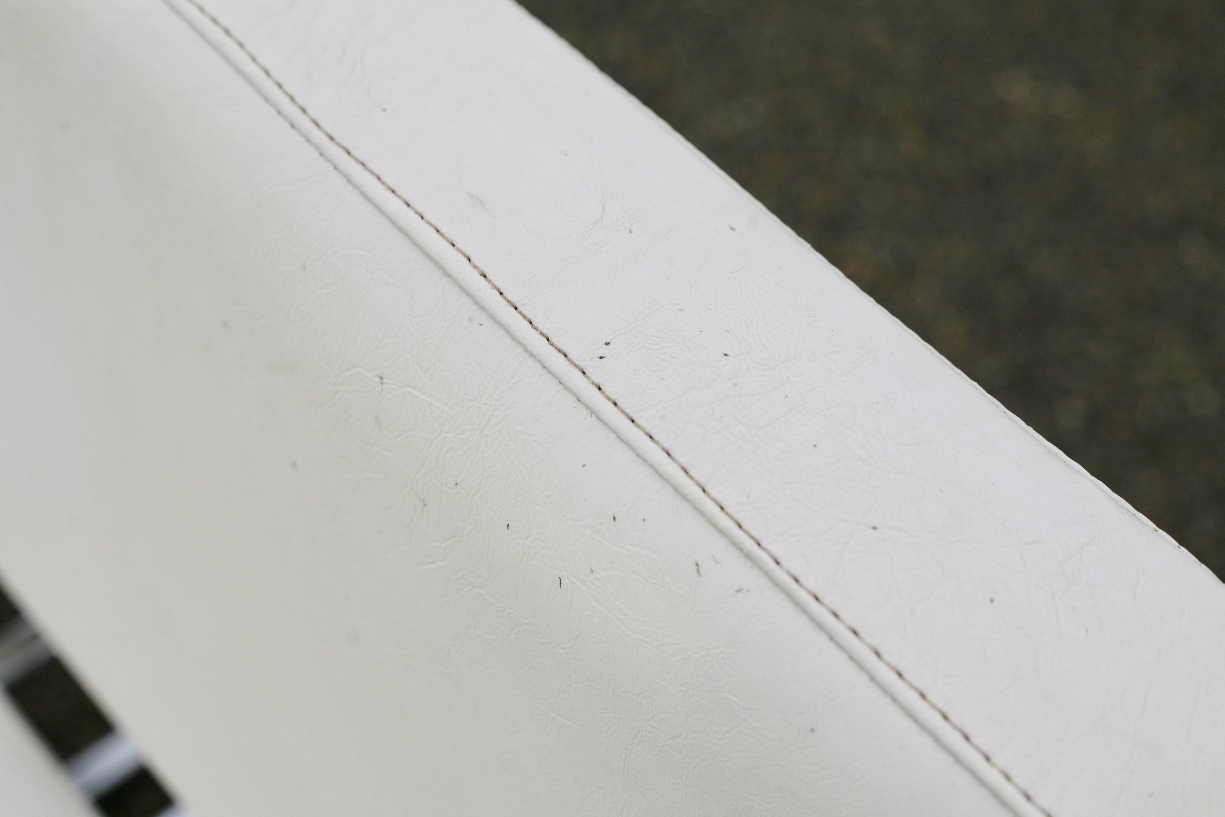 4 armchairs forming a modular sofa. Steel, imitation leather, 70s