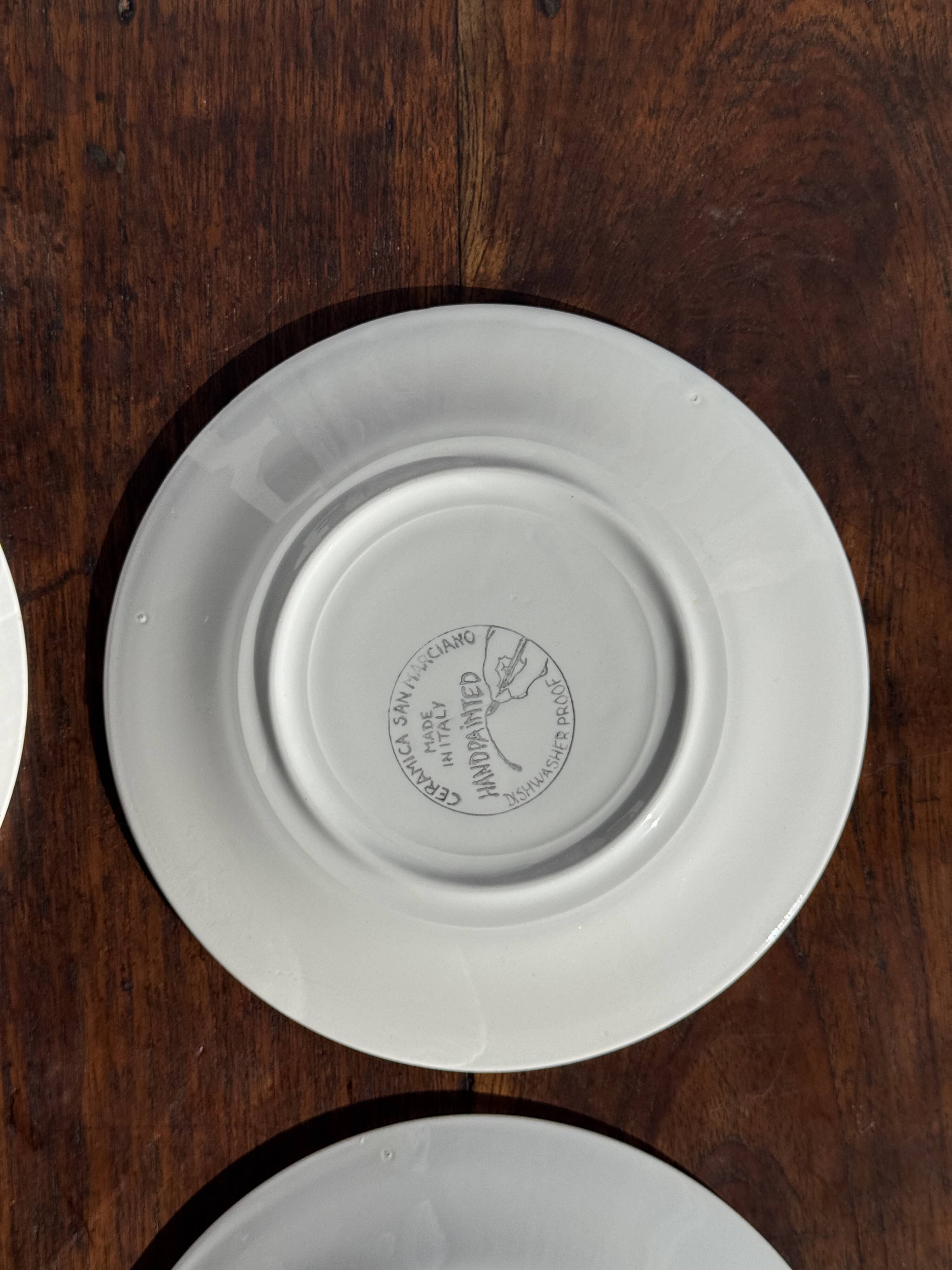 Set of 4 Italian ceramic plates in green, orange, and yellow splashes D20.