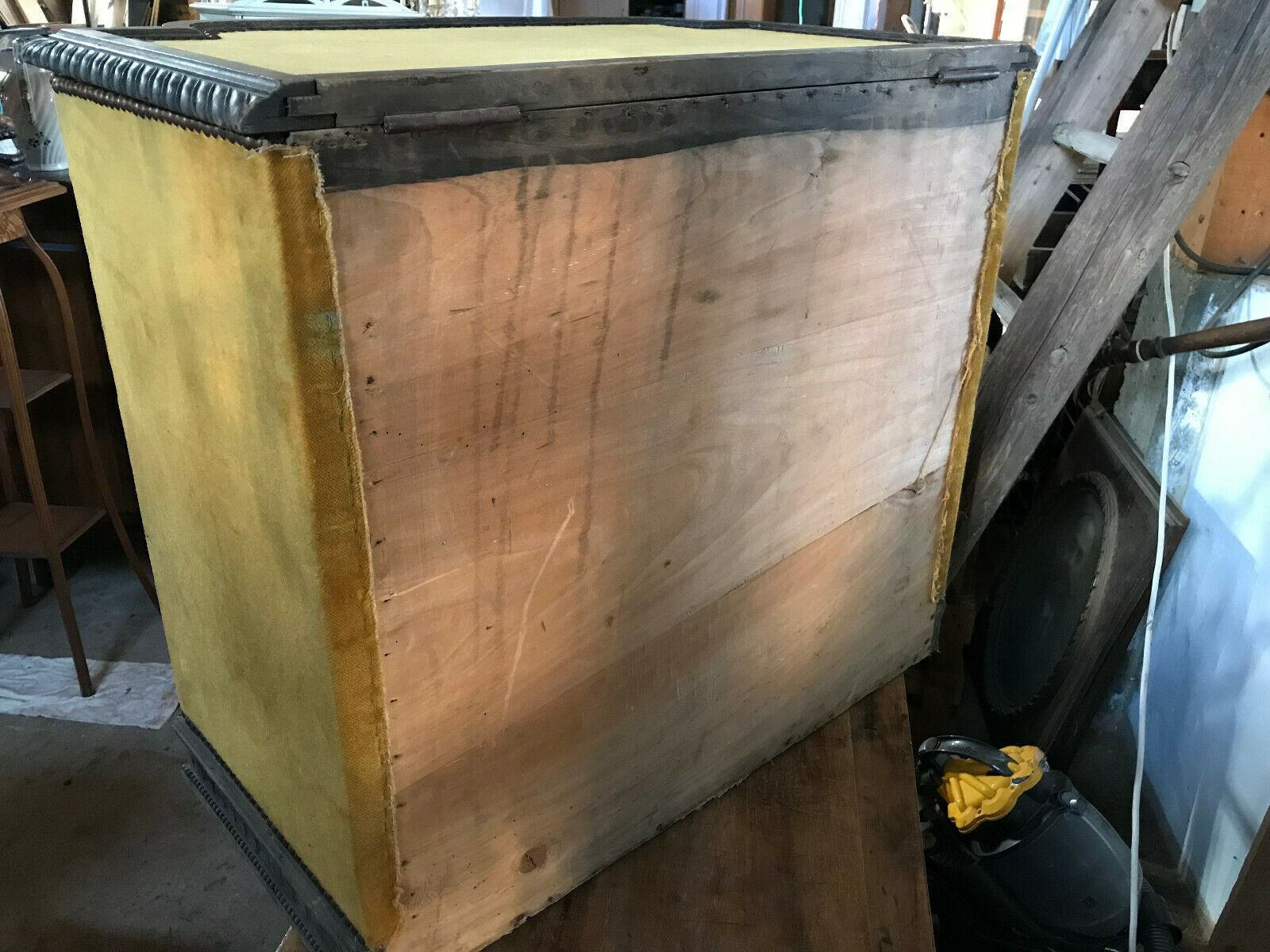 Old wooden chest and yellow velvet