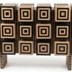 A low Art Deco buffet in two-tone relief marquetry.