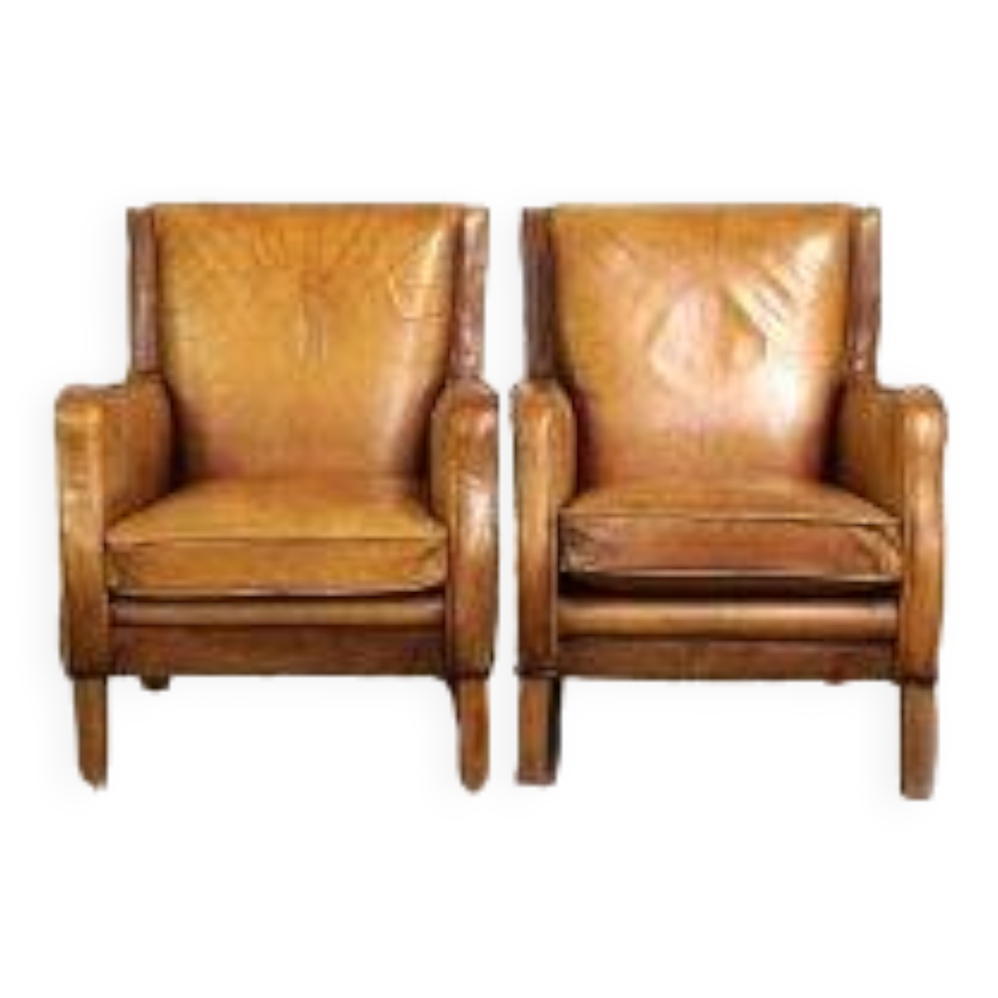 Set of English style light cognac colored leather armchairs.