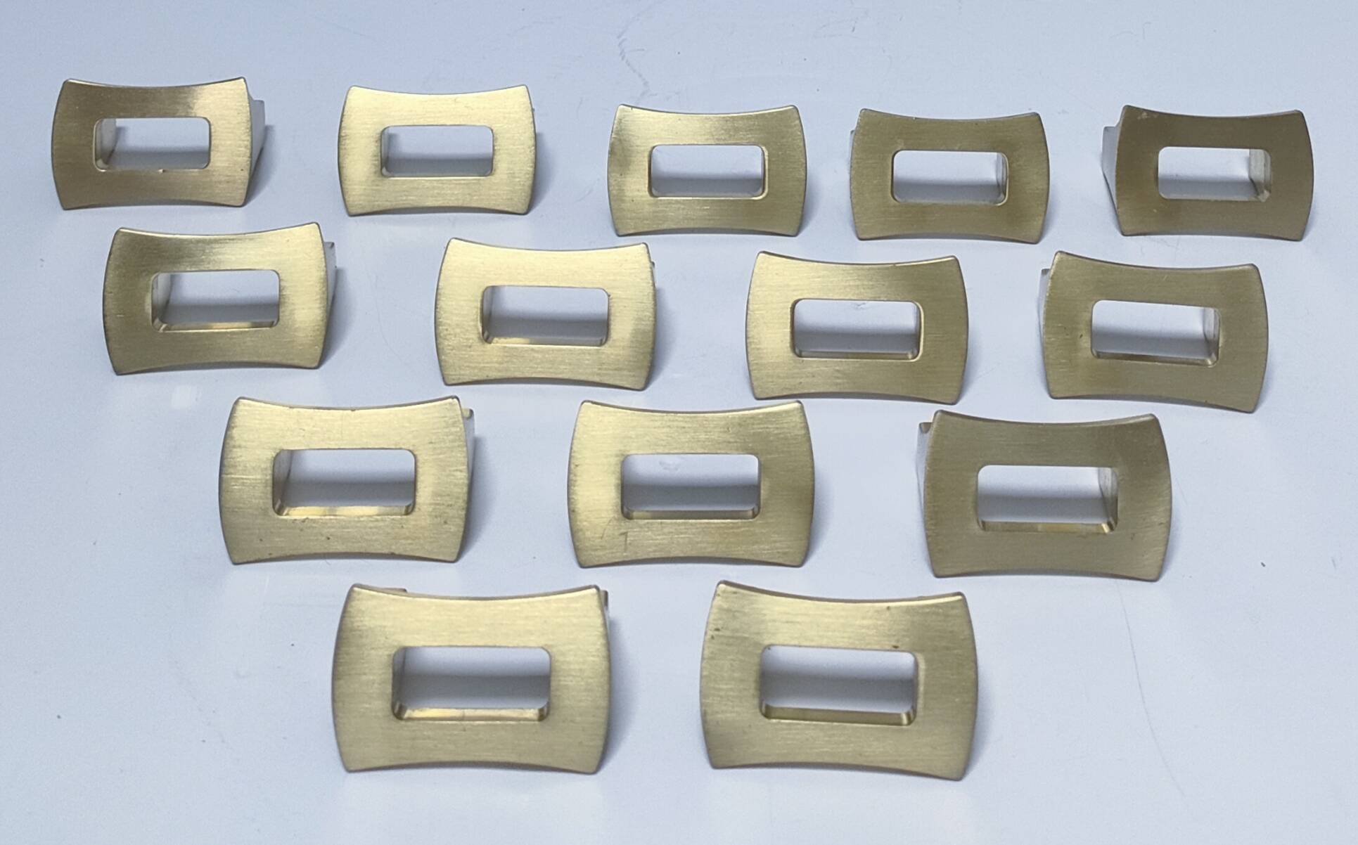 Fourteen 70s design gold steel furniture handles