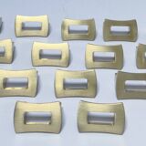 Fourteen 70s design gold steel furniture handles