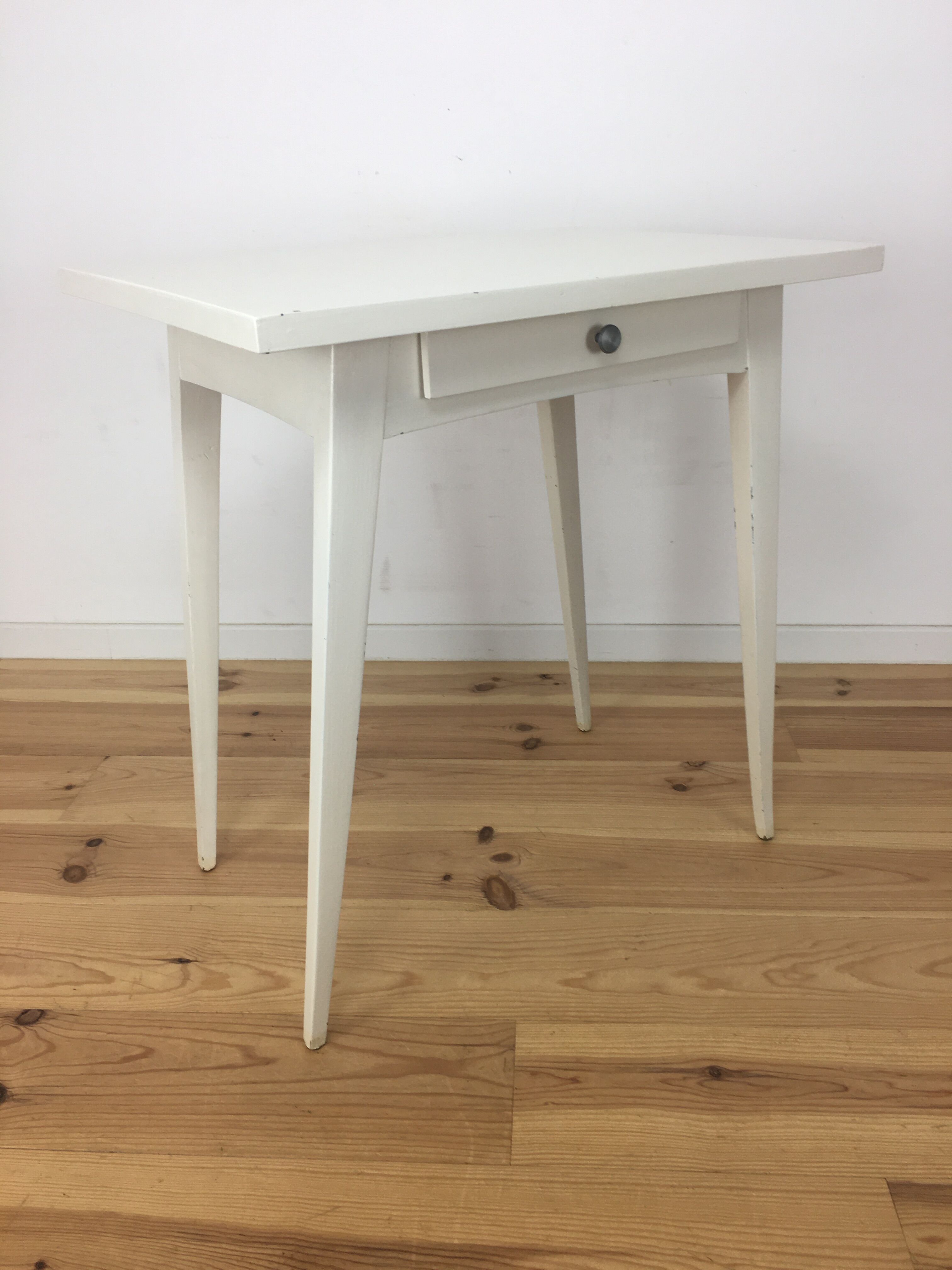 White wood desk foot compass