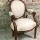 Louis XVI style children's armchair in carved walnut and beige antique upholstery