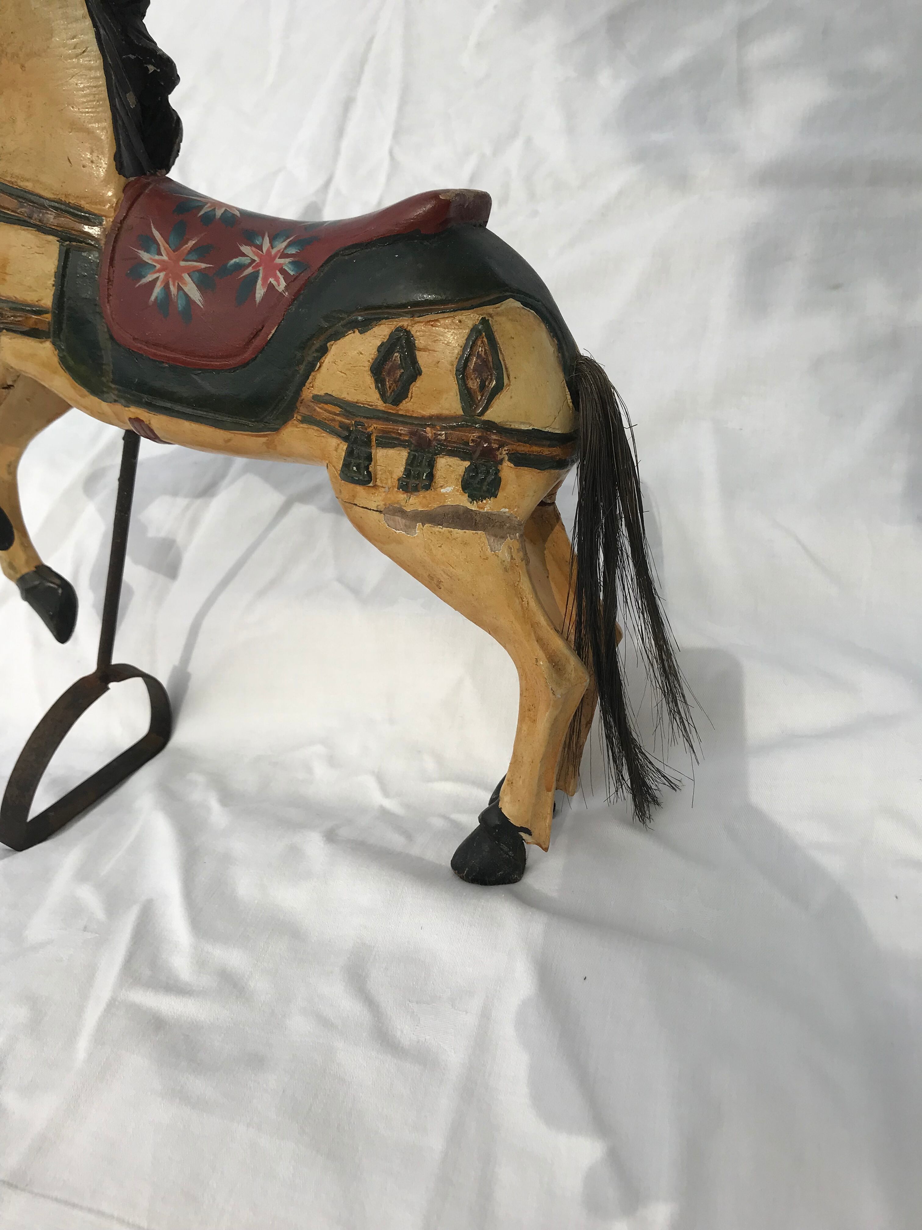 Wooden horse with period ironwork support